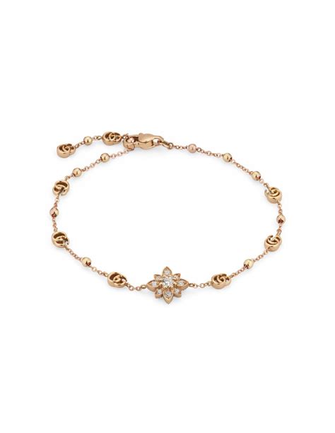 Gucci Flora 18k bracelet with diamonds .